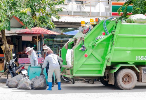 Man and van removing bulky items from a terraced house